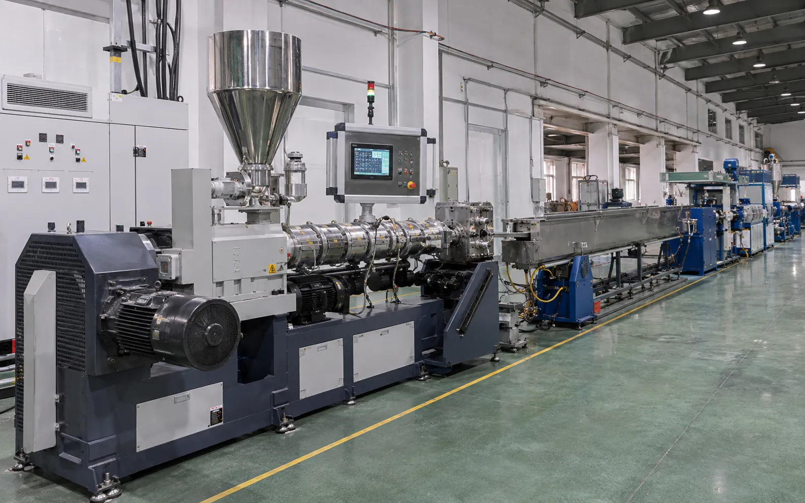 UET-65 building wire extrusion line with single stainless steel hopper, PLC touchscreen control panel, deep blue base frame and cooling trough for high-speed PVC PE building wire production up to 220 kg/h and 800 m/min line speed at UET Machine factory