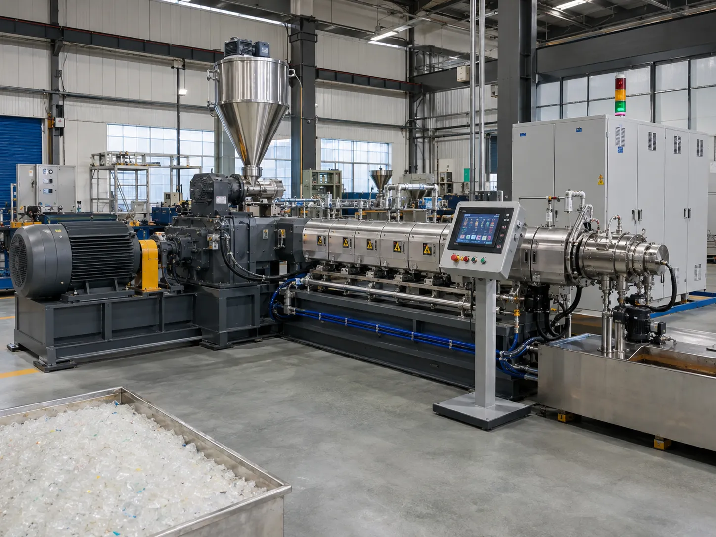 Industrial recycled plastic extruder pelletizing line with touchscreen HMI control panel and stainless steel barrel producing uniform plastic pellets in UET Machine factory