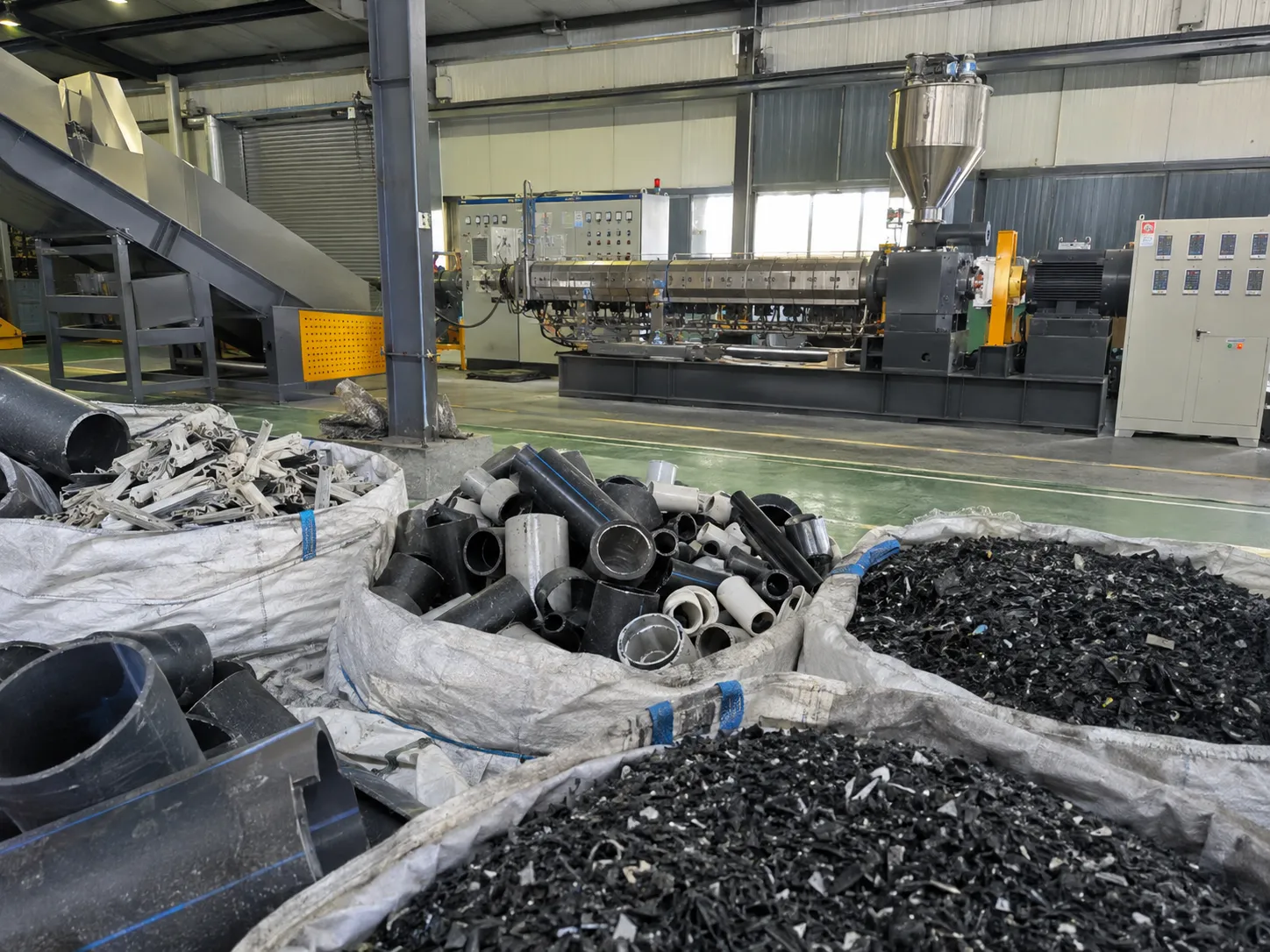 Recycled plastic PVC PE pipe fittings and granules as end products from plastic recycling extrusion line at UET Machine