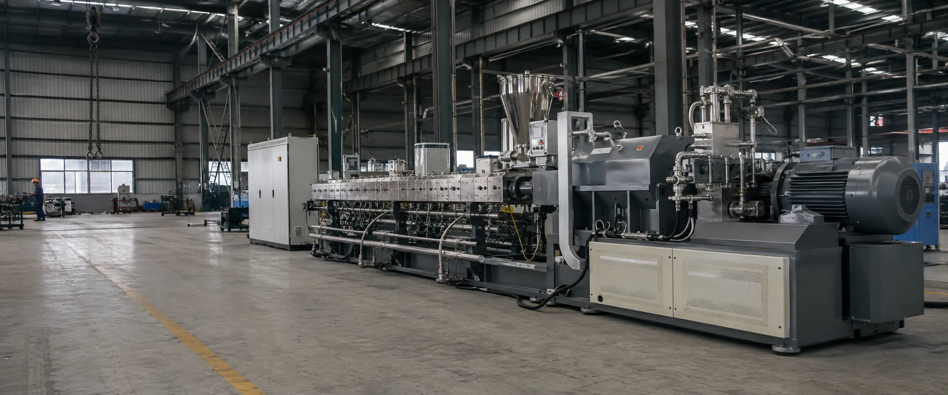 Industrial twin screw extruder machine in a Chinese manufacturing factory