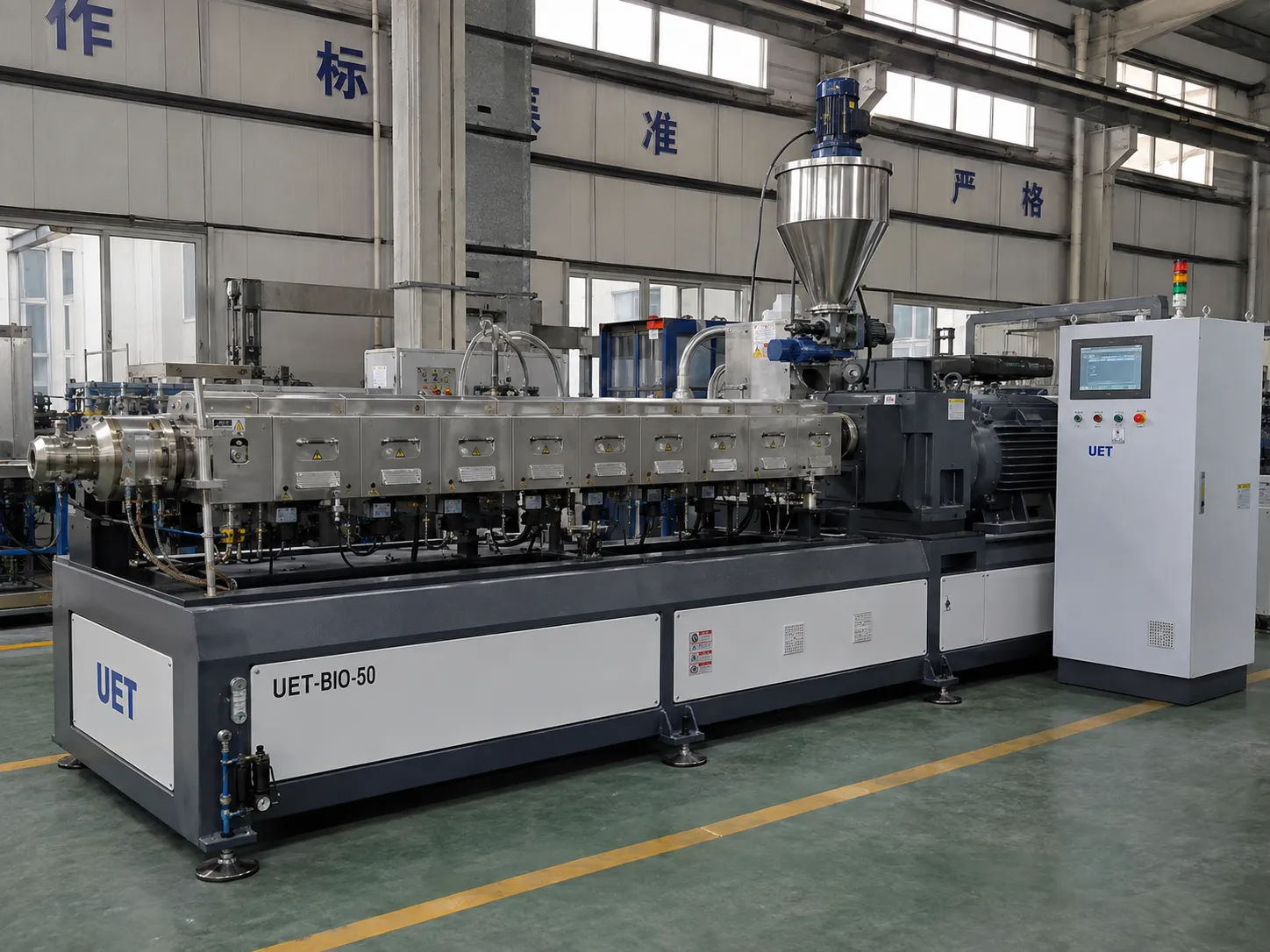 UET-BIO-50 pilot-scale bio extruder with blue drive motor and touchscreen HMI panel for biomass compounding and process validation production