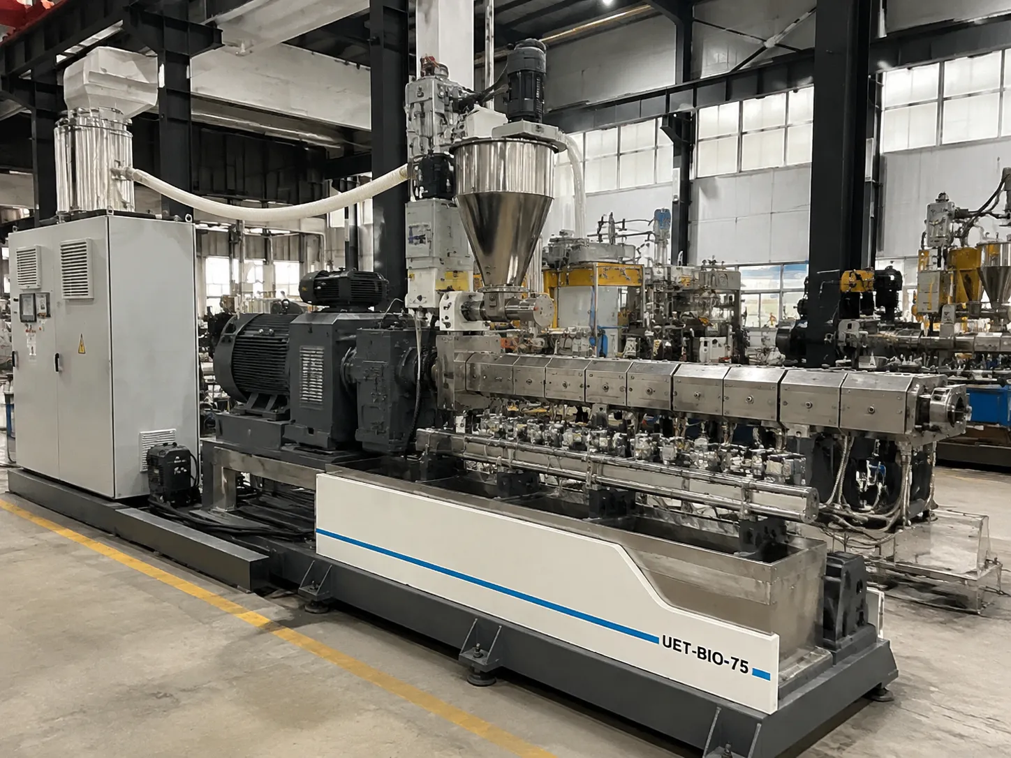 UET-BIO-75 heavy-duty industrial twin screw extruder with large feed hopper and PLC control system for continuous high-capacity biopolymer production