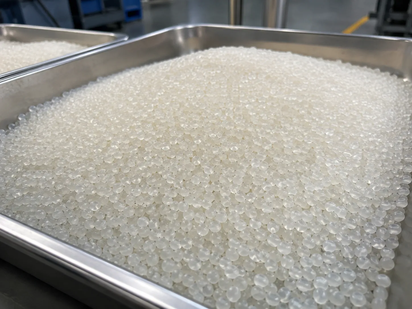 EVA-based hot melt adhesive pellets processed by underwater pelletizing system, semi-transparent with waxy texture, ideal for packaging and assembly applications.