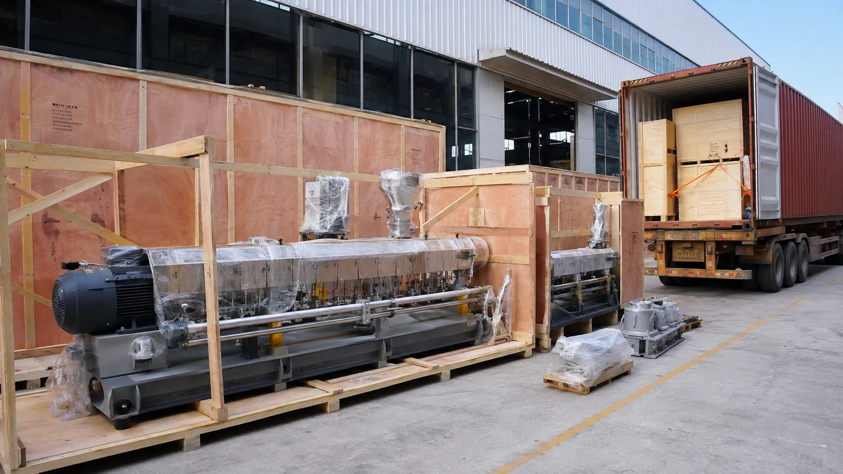 Extruder machines in wooden crates packed and loaded for export at UET Machine, China