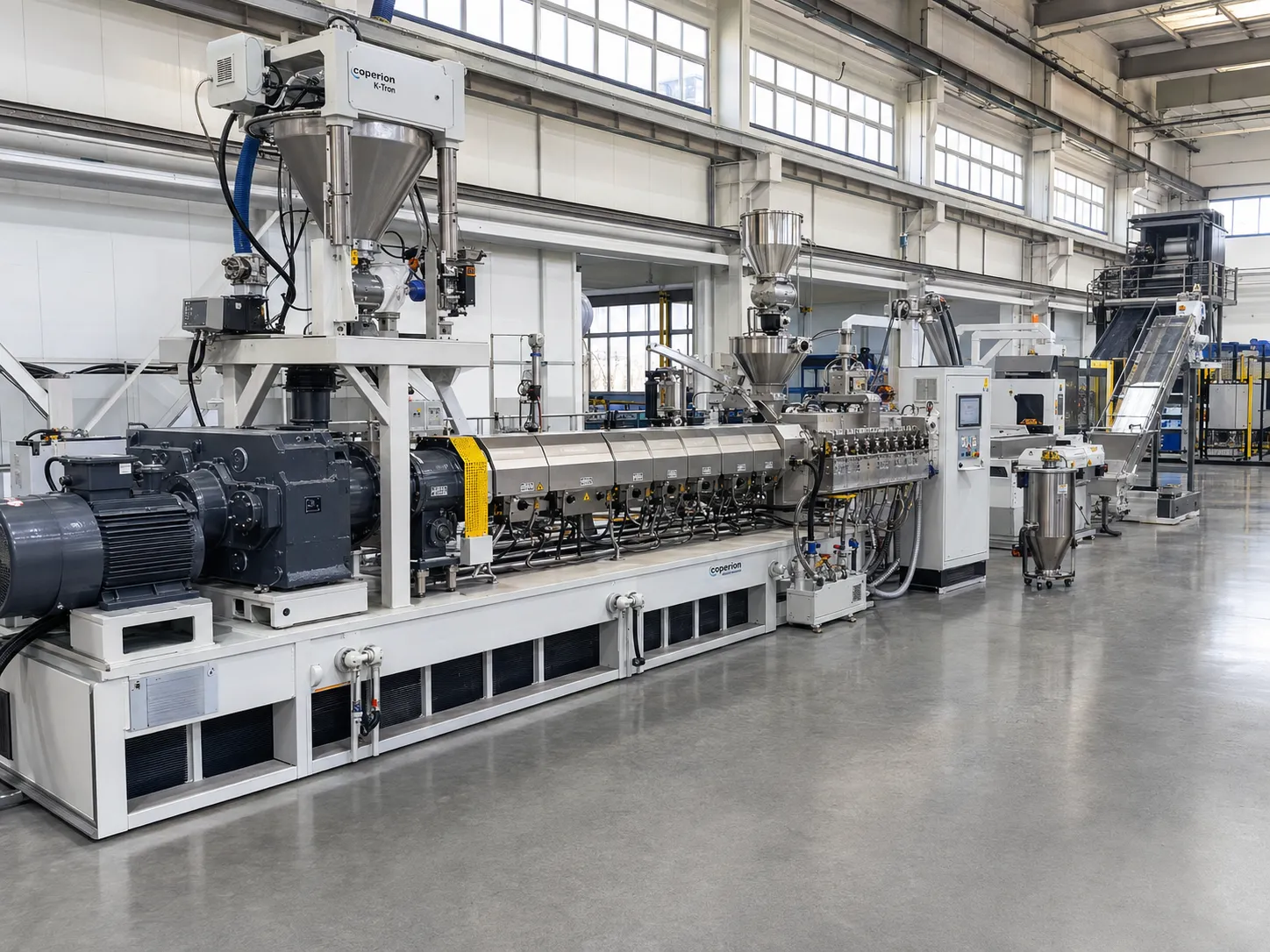 co-rotating twin screw plastic compounding extruder line with stainless steel hopper motor gearbox heating barrel sections control cabinet and conveyor for masterbatch engineering plastic and recycled pellet production at UET Machine China CE ISO 9001