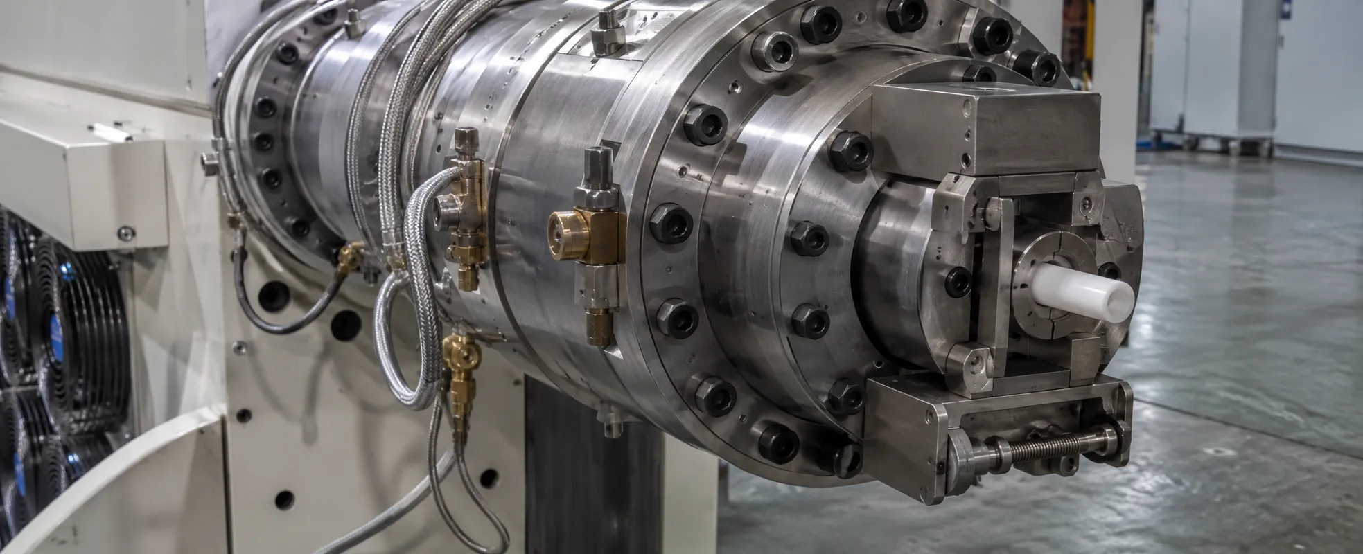 Precision multi-flange die head with quick clamp for PVC pipe and profile extrusion, mounted on a UET PVC extruder