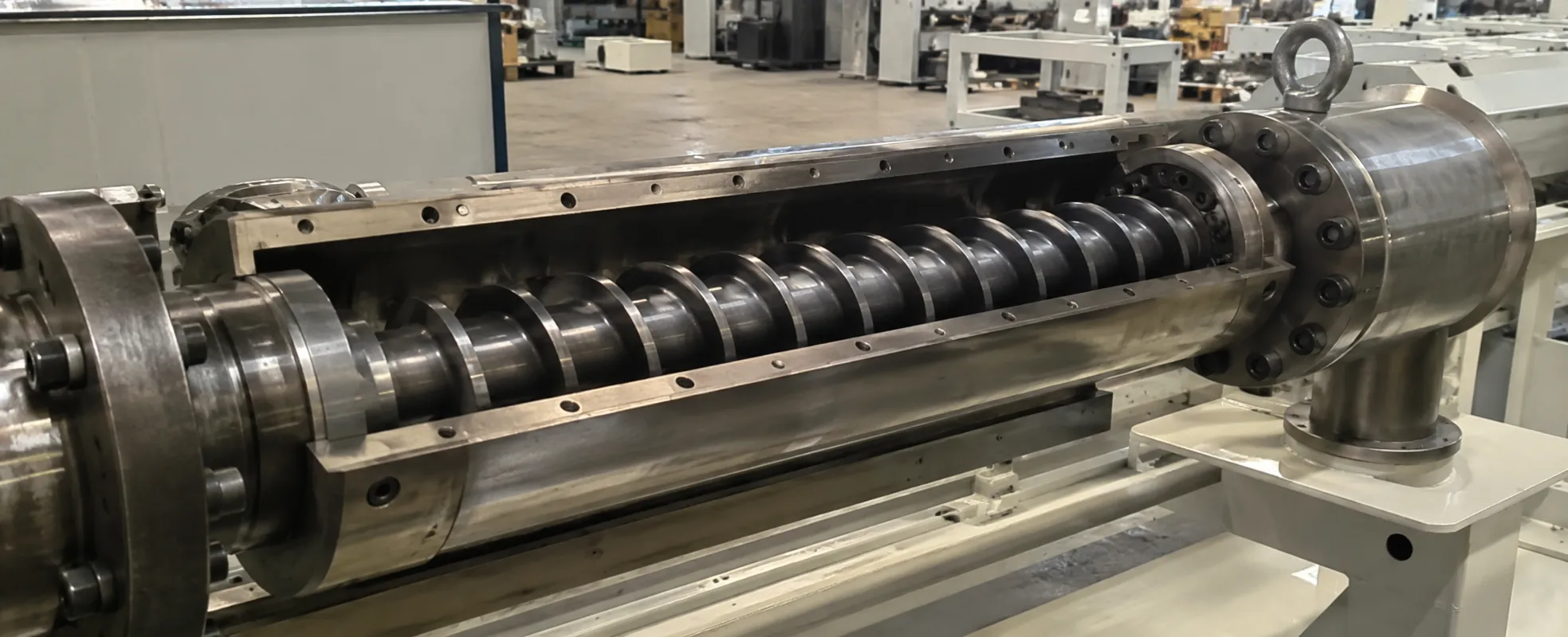 Nitrided 42CrMo screw and hardened barrel for PVC pipe and profile extrusion inside a UET PVC extruder, machined in our Qingdao factory